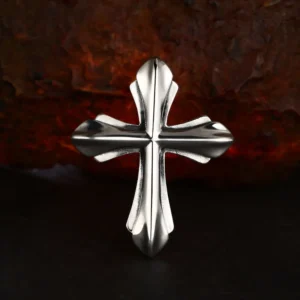 Centered front view chunky 3D 925 sterling silver gothic cross pendant, polished solid cross charm on dark rustic rock backdrop