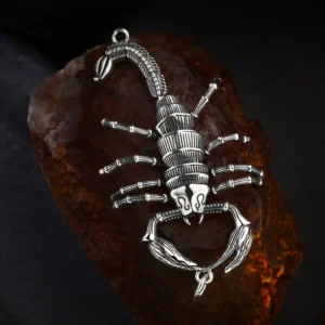 Antique oxidized 925 sterling silver articulated scorpion pendant, movable claws tail legs, gothic animal charm on rough rust rock background