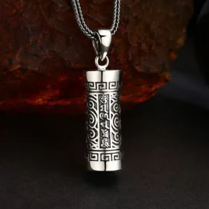 Antique oxidized 925 sterling silver tibetan gau box prayer cylinder pendant, six‑syllable mantra cloud scroll engraving on rough rust rock background