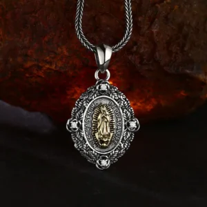 Antique oxidized two‑tone 925 sterling silver Our Lady of Guadalupe oval medal pendant, religious amulet with rose stone border, moody rough rock background