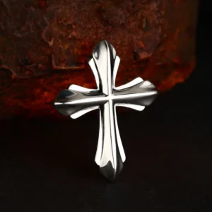 Bold 3D sculpted 925 sterling silver gothic cross pendant, high polished solid silver cross charm against rustic rock background