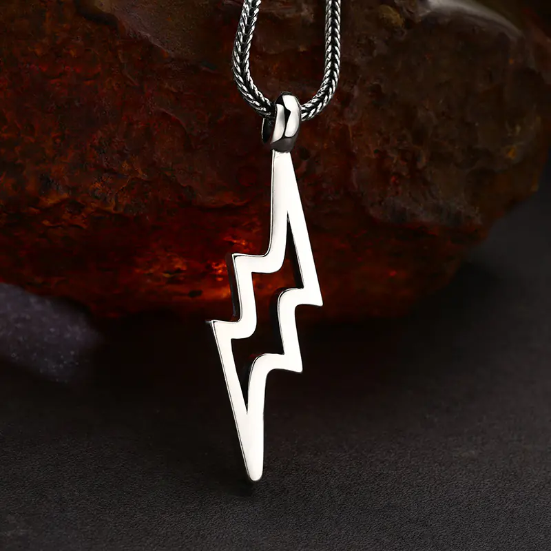 2-925‑sterling‑silver‑lightning‑bolt‑pendant‑front‑view‑scene‑shot‑wheat‑chain.jpg Front view hollow lightning bolt 925 sterling silver men pendant necklace vintage rock style jewelry