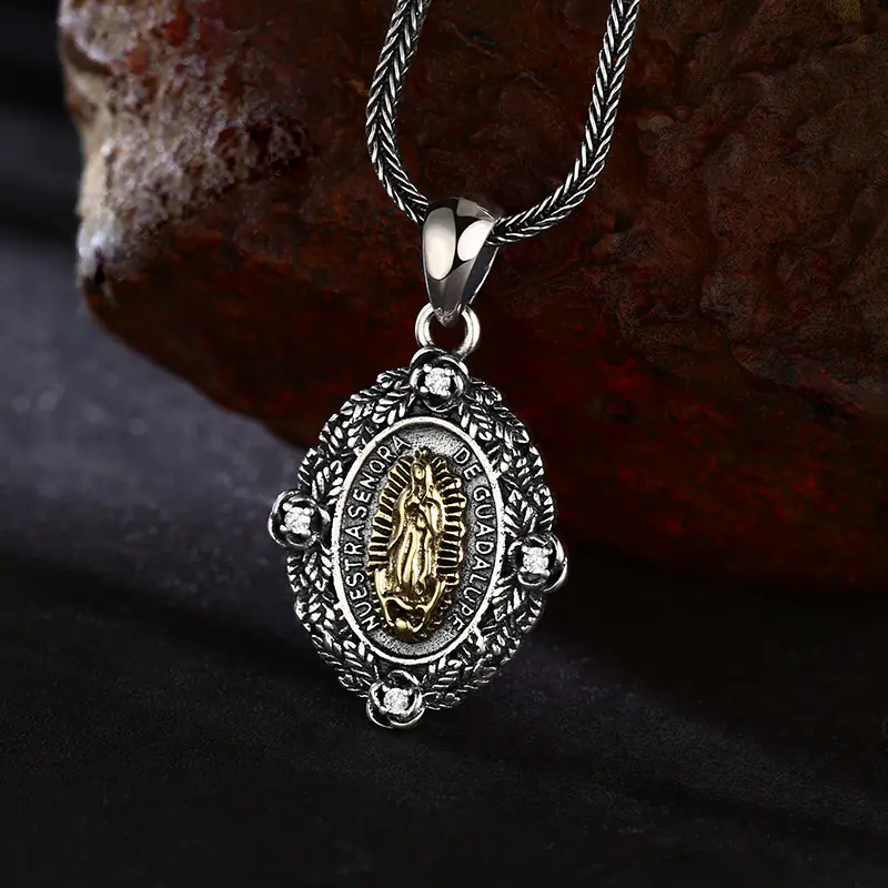 Front angled close‑up view two‑tone 925 sterling silver Our Lady of Guadalupe oval medal pendant, detailed carving, rose frame with small crystals religious charm