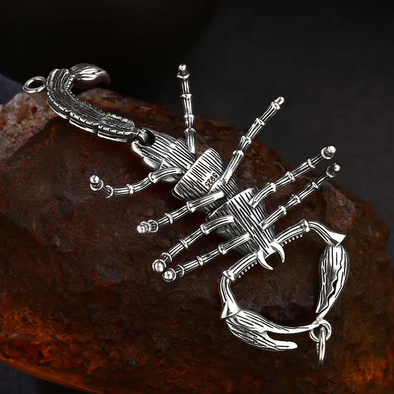 Back close‑up view of 925 silver scorpion pendant, clear S925 stamp mark, movable articulated joints detail, vintage oxidized animal charm