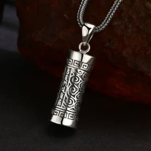 Side angle view 925 sterling silver openable tibetan prayer cylinder gau pendant, deep engraved mantra and cloud scroll patterns, vintage oxidized finish