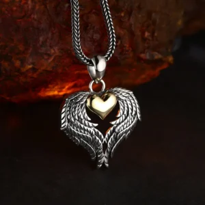 Slight side‑angled shot of two‑tone 925 silver angel wing gold heart pendant, displaying three‑dimensional carved feather relief details