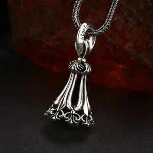 Close‑up detail of 925 silver tassel bell pendant, sterling stamp engraved on bail, antique oxidized hollow filigree vintage charm