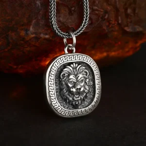 Tilted 3D detail shot 925 sterling silver roaring lion head square pendant, antique oxidized finish showing solid thickness and carving depth
