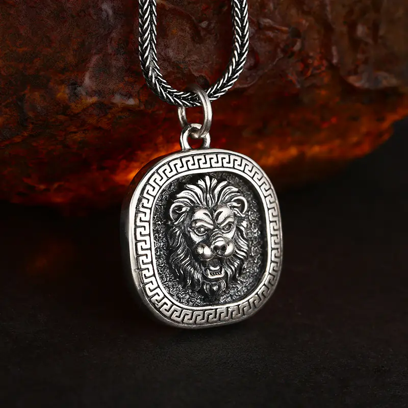3-retro‑lion‑head‑greek‑key‑925‑silver‑square‑pendant‑tilted‑3d‑oxidized‑detail‑shot.jpg Tilted 3D detail shot 925 sterling silver roaring lion head square pendant, antique oxidized finish showing solid thickness and carving depth