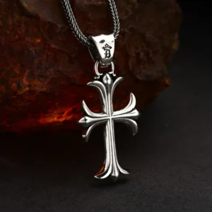 Side‑angle hanging view 925 sterling silver gothic fleur‑de‑lis cross pendant, shows pendant thickness and curved sculpted profile
