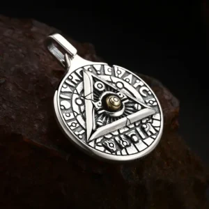 Macro close‑up of 925 silver all‑seeing‑eye triangle rune pendant, detailed embossed mystic rune and brass eye center ornament