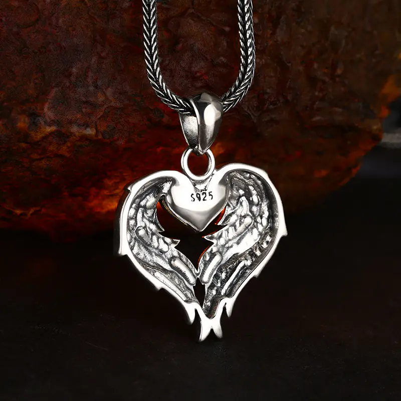 4-925‑silver‑angel‑wing‑gold‑heart‑pendant‑back‑view‑s925‑hallmark‑stamp‑close‑up.jpg Back close‑up of 925 sterling silver angel wing gold heart pendant, S925 hallmark stamp and reverse feather texture details