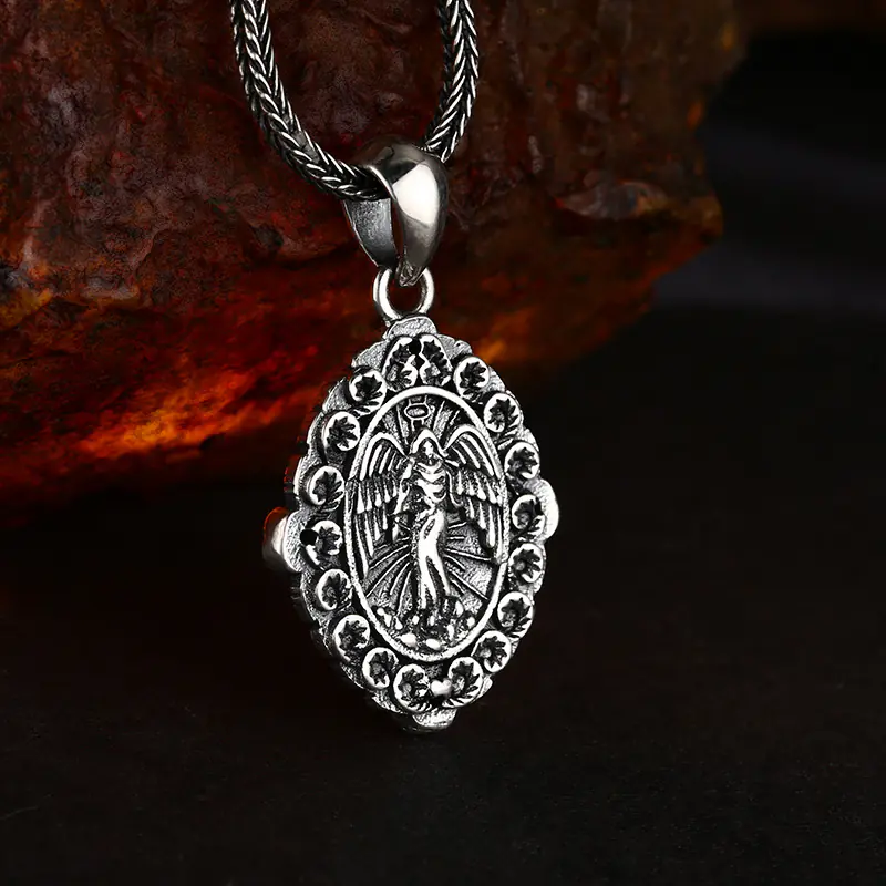 4-925‑silver‑our‑lady‑of‑guadalupe‑oval‑pendant‑macro‑back‑angel‑relief‑detail‑view.jpg Macro close‑up back view of 925 silver Our Lady of Guadalupe double‑sided pendant, carved archangel relief with floral border vintage religious jewelry