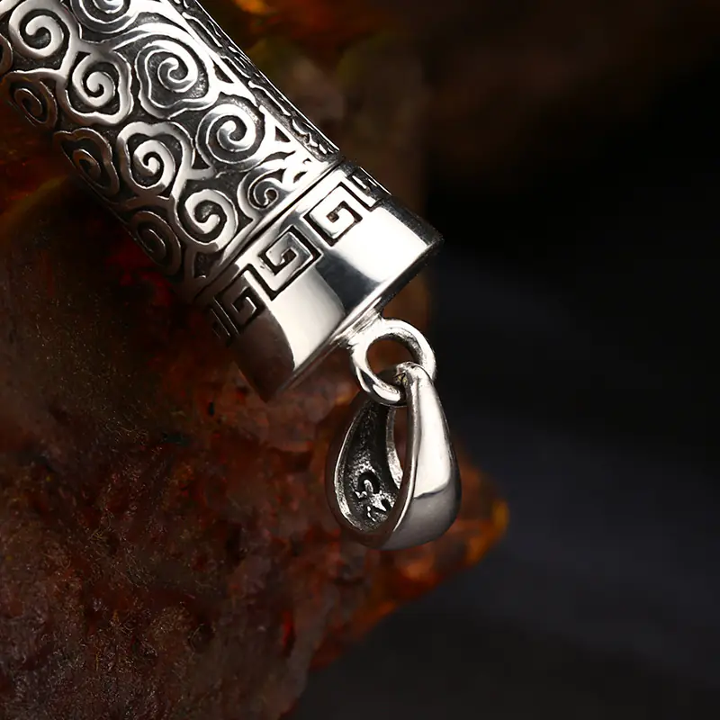 4-925‑sterling‑silver‑gau‑prayer‑cylinder‑pendant‑bail‑jump‑ring‑close‑up‑detail‑shot.jpg Macro close‑up on polished bail and jump ring of 925 silver tibetan gau box prayer cylinder pendant, solid silver construction detail