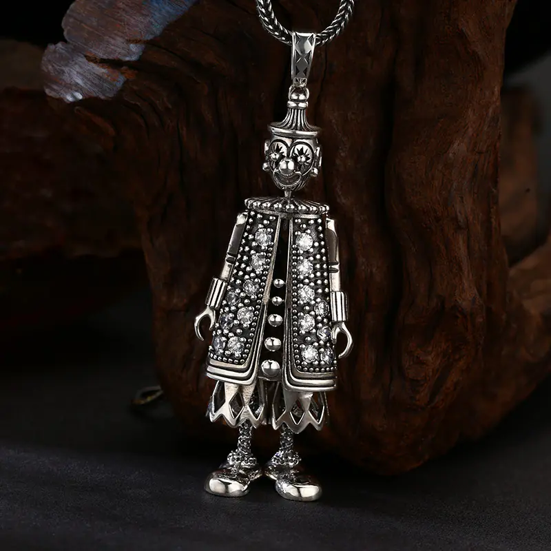 925 sterling silver crystal inlay clown doll pendant with chain on wooden texture background