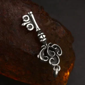 Close up back view of vintage scroll carved 925 silver key pendant