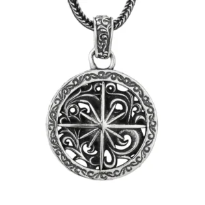 Hero shot vintage oxidized 925 sterling silver open‑work star compass round medallion pendant, hollow floral scroll border with silver wheat chain on white background